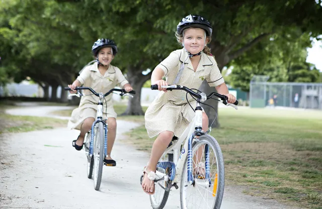 Kids riding on a bike track