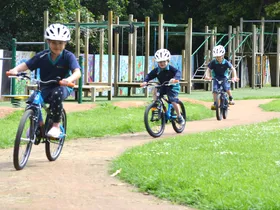 Children riding the track at Royal Oak School